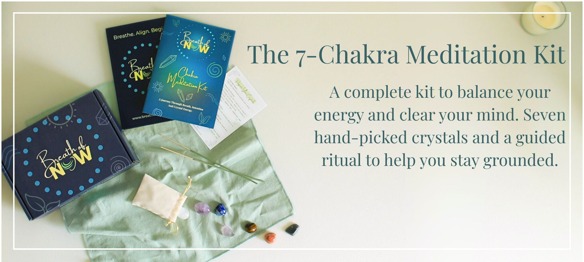 Overhead view of the Breath of Now 7-Chakra Meditation Kit including seven hand-picked crystals, sage incense sticks, meditation booklet, cleansing-programming flash card, journal, and a colourful illustrated box for energy balancing. Placed on a sage green linen cloth. Text reads: "The 7-Chakra Meditation Kit. A complete kit to balance your energy and clear your mind. Seven hand-picked crystals and a guided ritual to help you stay grounded."
